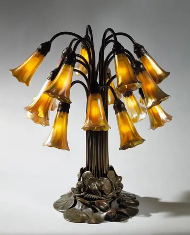 Mrs. Maud Russell Lorraine ("Emarel") Freshel (American), designer, Tiffany Studios, maker, Eighteen Light Lily Lamp, after 1902, patinated bronze and gold favrile glass. Purchased with funds from the Art Collectors’ Council. The Huntington Library, Art M